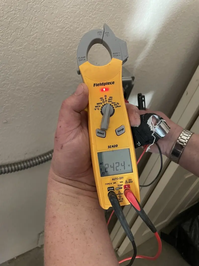 Voltage testing with clamp meter during Outlet Installation in Tenafly